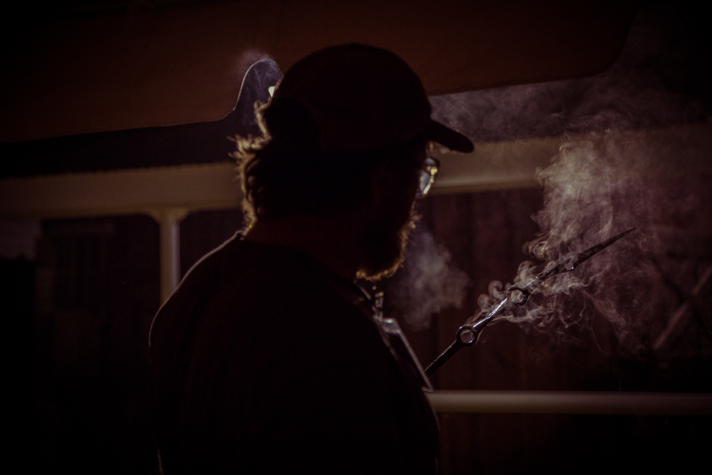 CBA_WesternStatesConference-40 A blacksmith admires his work after applying a protective wax coating.